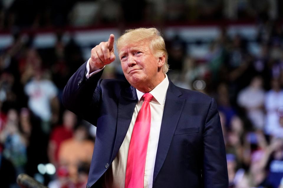 Former President Donald Trump points to the crowd as he arrives to speak at a rally Friday in Prescott, Arizona.