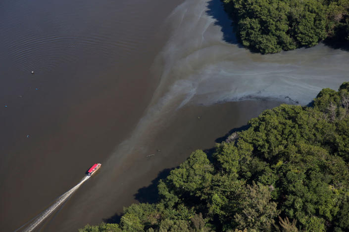<p>In this July 5, 2016 photo, an aerial view shows sewage moving into the canals that rim the Barra de Tijuca neighborhood near Olympic Park in Rio de Janeiro, Brazil. While local authorities including Rio Mayor Eduardo Paes have acknowledged the failure of the city’s water cleanup efforts, calling the “lost chance” a “shame,” Olympic officials continue to insist Rio’s waterways will be safe for athletes and visitors. (AP Photo/Felipe Dana)