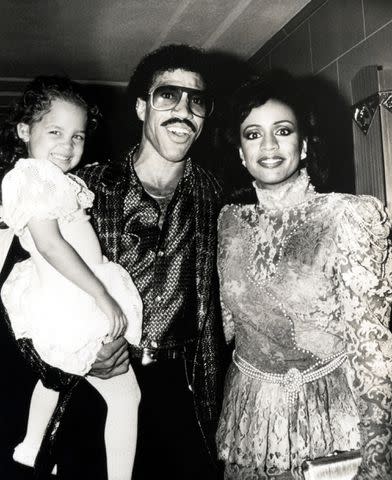 <p>Ron Galella/Ron Galella Collection via Getty</p> Nicole Richie with dad Lionel Richie and mom Brenda Harvey Richie