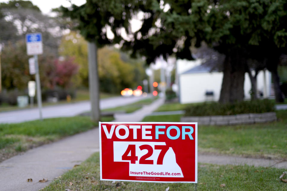 A yard sign promoting Initiative 427