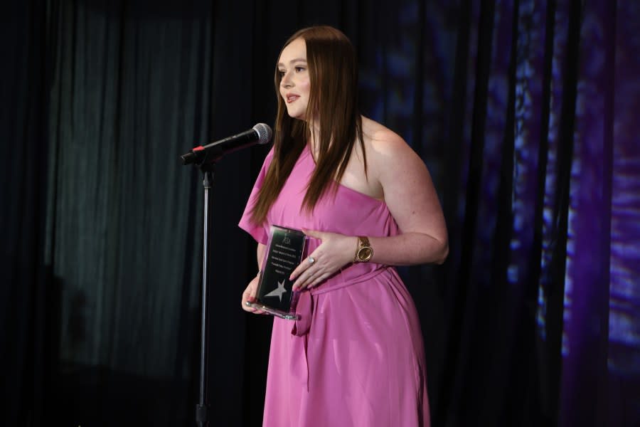 Sports Director Olivia Whitmire accepts 2024 Best in Broadcasting award for “Football Friday Overtime” (photo: Alabama Broadcasters Association)