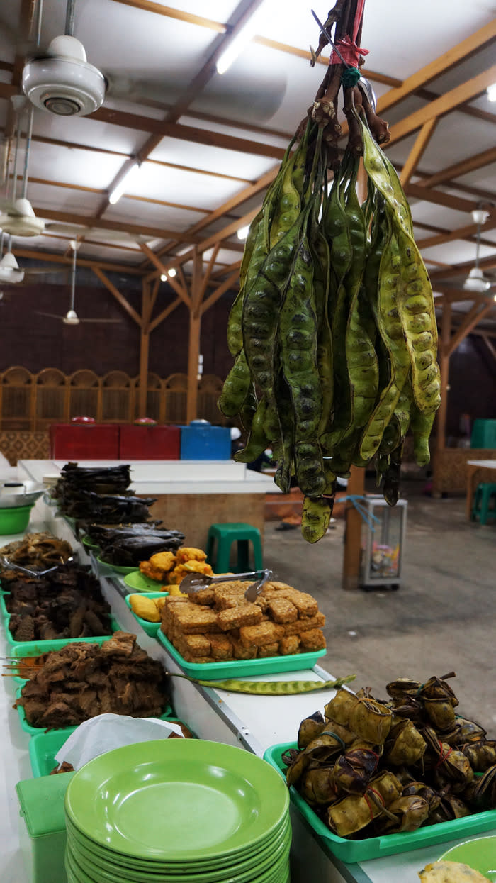 Bitter sweet: Green Petai or bitter beans (hanged on top right) is displayed among other varieties of Sundanese delicacies at the Ampera Restaurant. (