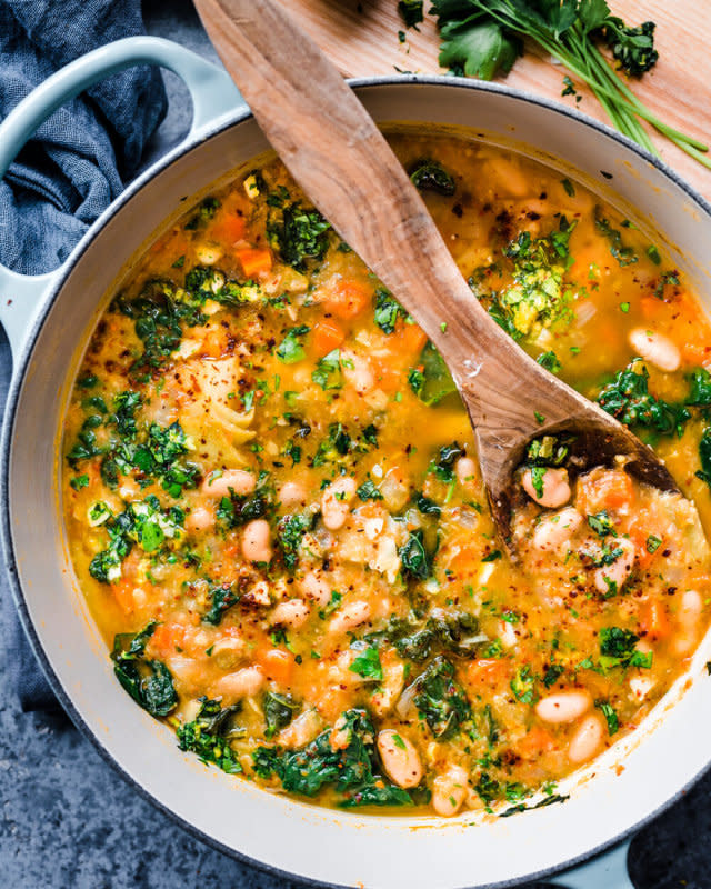 <p>Rainbow Plant Life</p><p>This creamy white bean soup with kale and gremolata is a hearty yet healthy one-pot soup perfect for cold weather!</p><p><strong>Get the recipe: <a href="https://rainbowplantlife.com/creamy-white-bean-soup-with-kale-and-gremolata/" rel="nofollow noopener" target="_blank" data-ylk="slk:Creamy White Bean Soup with Kale and Gremolata;elm:context_link;itc:0;sec:content-canvas" class="link rapid-noclick-resp"><em>Creamy White Bean Soup with Kale and Gremolata</em></a></strong></p>