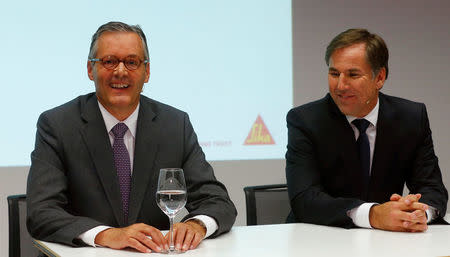 Paul Haelg (L), chairman of the board and CEO Jan Jenisch of Swiss chemicals group Sika, address a news conference in Zurich, Switzerland October 28, 2016. REUTERS/Arnd Wiegmann