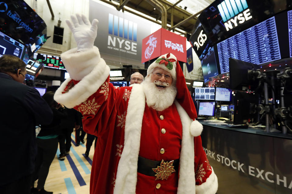 Santa walks the floor of the New York Stock Exchange before joining Marine Toys for Tots opening bell ceremonies, Thursday, Dec. 5, 2019. Stocks are opening slightly higher on Wall Street led by technology companies and banks. (AP Photo/Richard Drew)