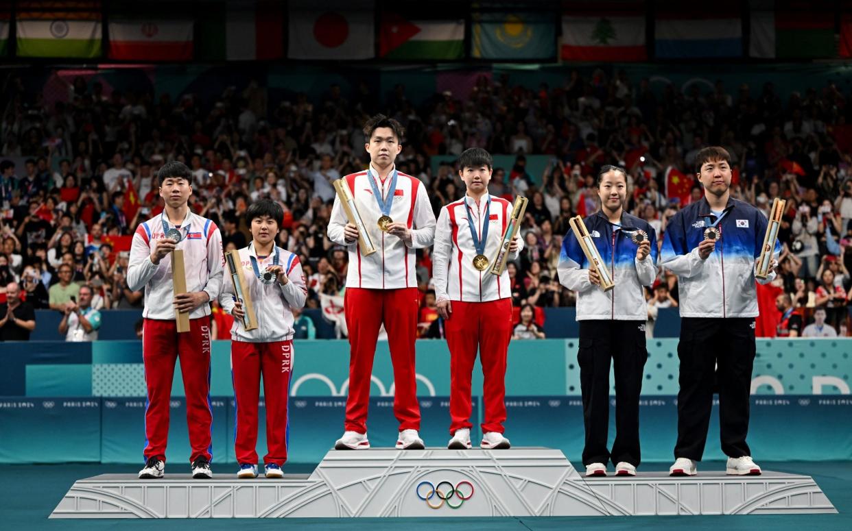 Ri Jong Sik, and Kim Kum Yong, left, are both undergoing various regime procedures following their Olympic win alongside other North Korean athletes