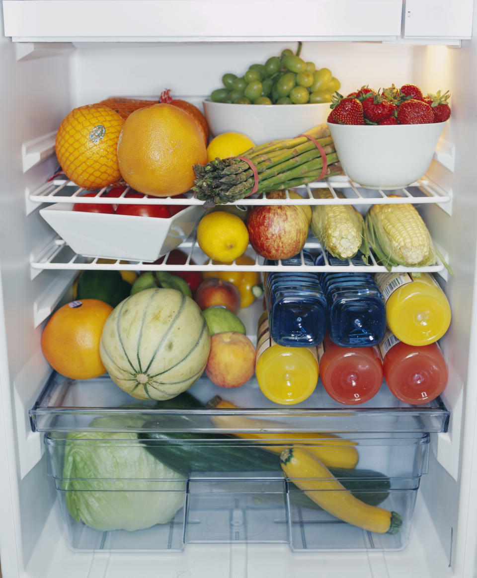 Photo shows a fridge full of fresh produce.