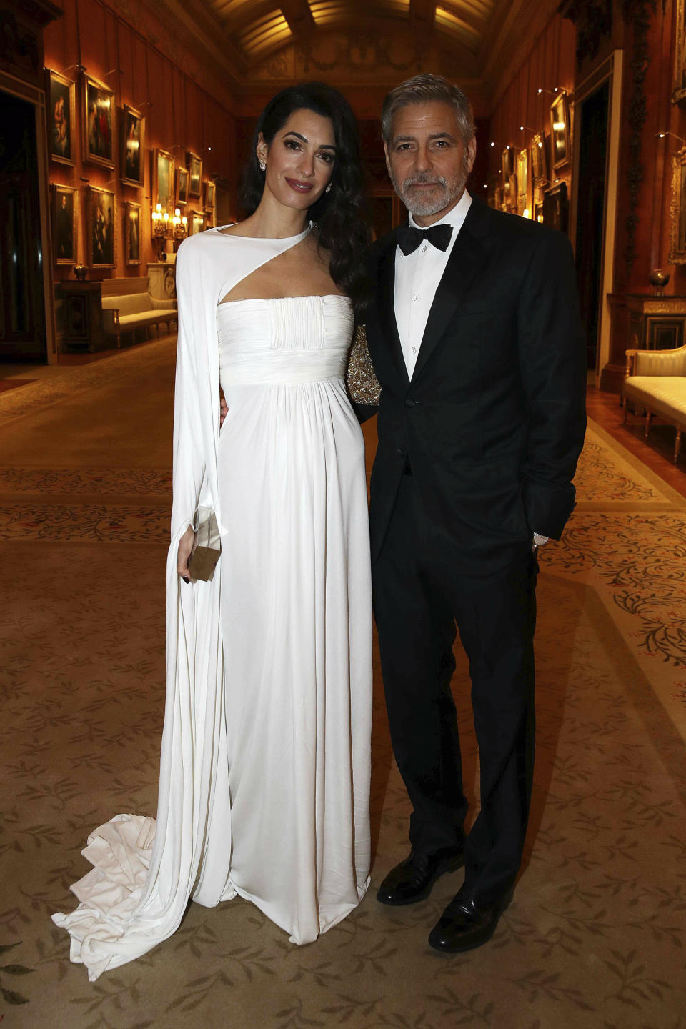 Amal and George Clooney attend a dinner to celebrate The Prince's Trust, hosted by Prince Charles, at Buckingham Palace on March 12 in London.&nbsp; (Photo: KGC-375/STAR MAX/IPx)