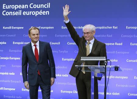 Former Polish Prime Minister Donald Tusk (L) and outgoing European Council President Herman Van Rompuy attend a ceremony, during which Tusk took over from Van Rompuy and officially replaced him as head of the European Council, in Brussels in this December 1, 2014 file photo. REUTERS/Yves Herman/Files