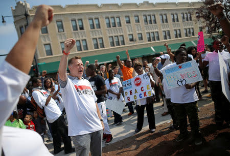 Father Michael Pfleger takes part in an anti-violence peace demonstration in a South Side neighborhood in Chicago, Illinois, September 24, 2016. REUTERS/Jim Young