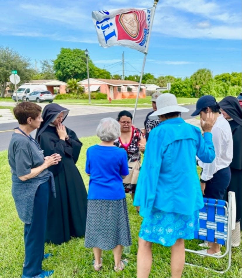 Anti-abortion activists gathered in prayer last month in front of West Palm Beach’s Planned Parenthood on North Florida Mango Road.