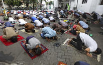 Muslim men pray spaced apart amid concerns of coronavirus outbreak during a Friday prayer at a mosque in Jakarta, Indonesia, Friday, June 5, 2020. Muslims in Indonesia's capital held their first communal Friday prayers as mosques closed by the coronavirus outbreak for nine weeks reopened at half capacity. (AP Photo/Dita Alangkara)