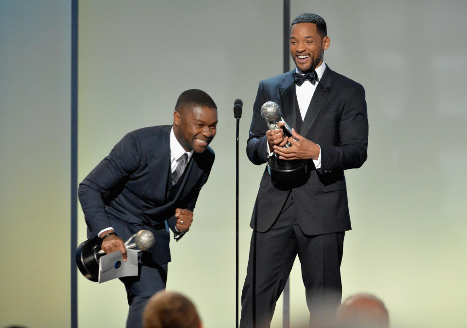 PASADENA, CA - FEBRUARY 06:  Actor David Oyelowo (L) accepts the award for Outstanding Actor in a Motion Picture for 'Selma', from actor Will Smith onstage at the 46th Annual NAACP Image Awards on February 6, 2015 in Pasadena, California.  (Photo by Earl Gibson III/WireImage)