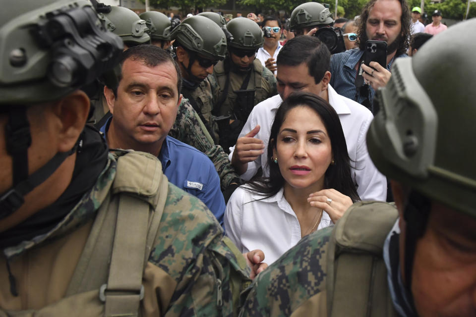 Presidential candidate Luisa González, of the Citizen's Revolution Political Movement, leaves a polling station after voting in a snap election in Canuto, Ecuador, Sunday, Aug. 20, 2023. The election was called after President Guillermo Lasso dissolved the National Assembly by decree in May to avoid being impeached. (AP Photo/Ariel Ochoa)