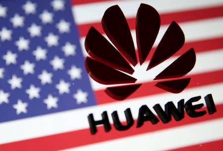 FILE PHOTO: A 3D printed Huawei logo is placed on glass above displayed U.S. flag in this illustration taken January 29, 2019. REUTERS/Dado Ruvic/Illustration/File Photo