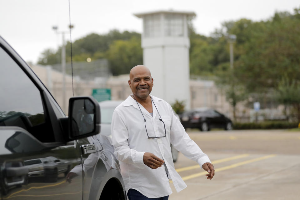 Elvis Brooks smiles as he leaves the Louisiana State Penitentiary at Angola in Angola, La., Wednesday, Oct. 16, 2019. Brooks, who has spent two-thirds of his life in prison for a killing he always denied committing, pleaded guilty to manslaughter and was released. Innocence Project New Orleans attorneys say evidence that would have cleared him was withheld at trial. Prosecutors offered the plea agreement Tuesday which was accepted. (AP Photo/Gerald Herbert)