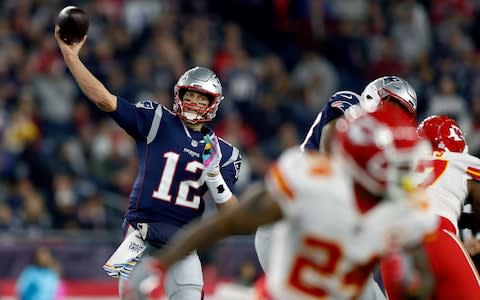 New England Patriots quarterback Tom Brady (12) passes under pressure from the Kansas City Chiefs during the first half of an NFL football game - Credit: (AP Photo/Michael Dwyer)