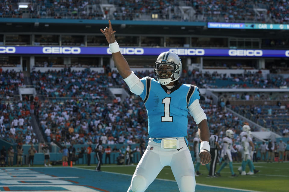 Carolina Panthers quarterback Cam Newton (1) celebrates after scoring a touchdown during the first half of an NFL football game against the Miami Dolphins, Sunday, Nov. 28, 2021, in Miami Gardens, Fla. (AP Photo/Lynne Sladky)