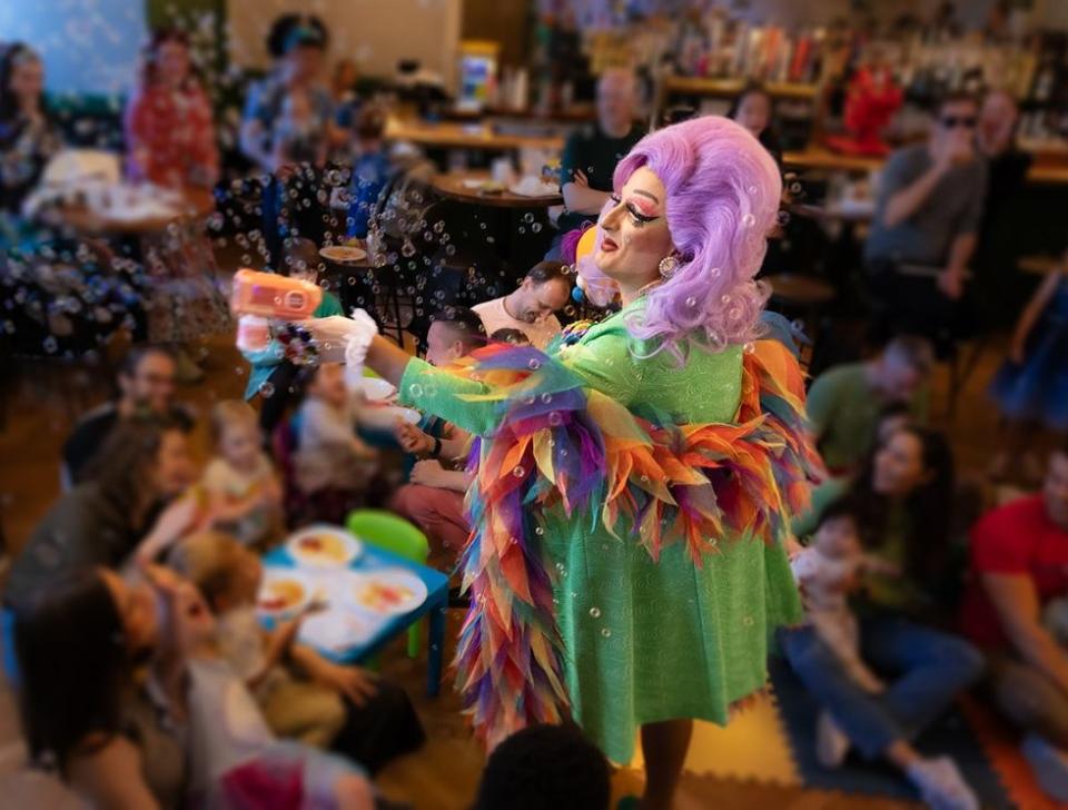 drag queen Tara Hoot blowing bubbles