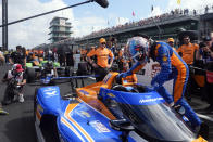 Kyle Larson climbs into his car during qualifications for the Indianapolis 500 auto race at Indianapolis Motor Speedway, Saturday, May 18, 2024, in Indianapolis. (AP Photo/Darron Cummings)