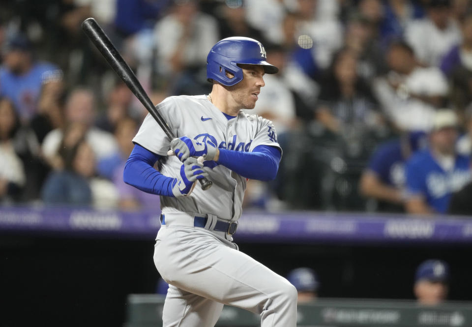 Los Angeles Dodgers' Freddie Freeman grounds into a double play against Colorado Rockies starting pitcher Chris Flexen to end the top of the fifth inning of a baseball game Thursday, Sept. 28, 2023, in Denver. (AP Photo/David Zalubowski)