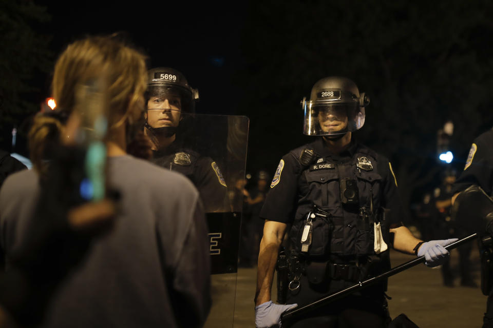 Police form a security line after protesters tried to topple a statue of Andrew Jackson in Lafayette Park near the White House in Washington, on Monday, June 22, 2020. (AP Photo/Maya Alleruzzo)