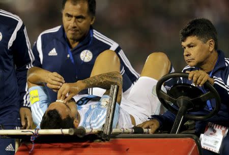 Argentina's Carlos Tevez is carried on stretcher off the field during the 2018 World Cup qualifying soccer match against Paraguay at the Defensores del Chaco stadium in Asuncion, Paraguay, October 13, 2015. REUTERS/Mario Valdez