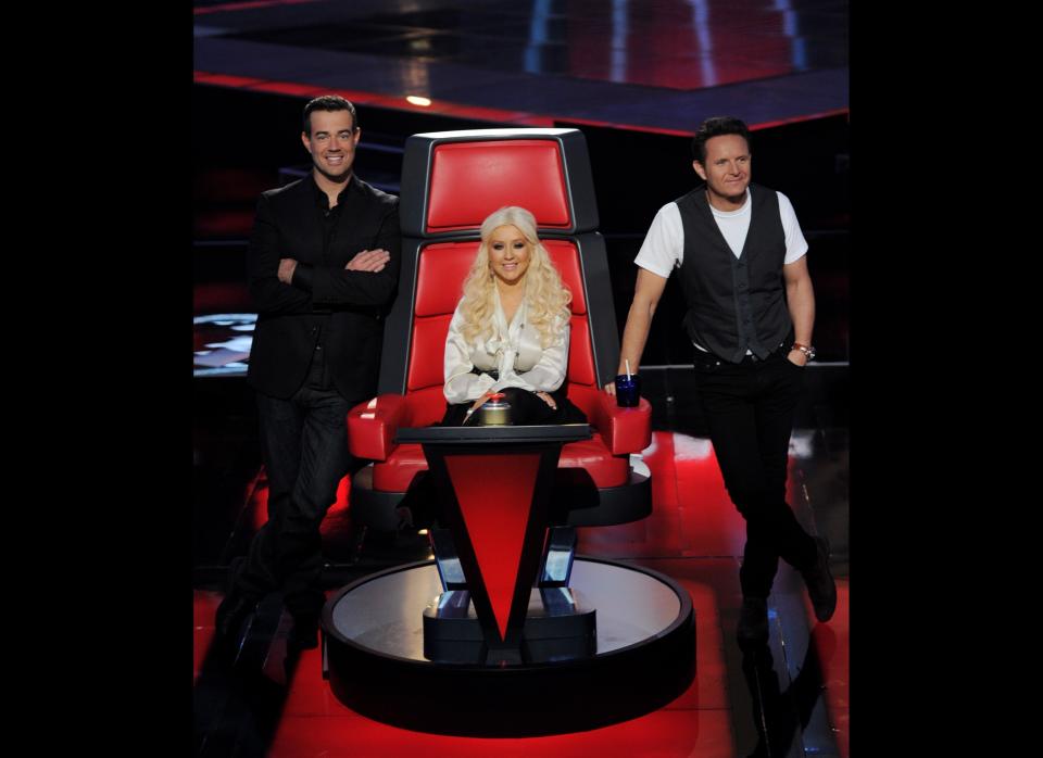 Host Carson Daly, singer Christina Aguilera and executive producer Mark Burnett appear at a press junket for NBC's 'The Voice' at Sony Studios on October 28, 2011 in Culver City, California. (Getty)