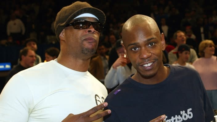 In this Feb. 2004 photo, comedians and friends Damon Wayans (left) and Dave Chappelle (right) hang out at the New York Knicks versus Cleveland Cavaliers NBA game at Madison Square Garden. (Photo: Ray Amati/Getty Images)