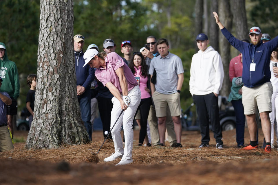 Cameron Smith, of Australia, hits from the pine straw along the 16th fairway during the final round of play in The Players Championship golf tournament Monday, March 14, 2022, in Ponte Vedra Beach, Fla. (AP Photo/Lynne Sladky)