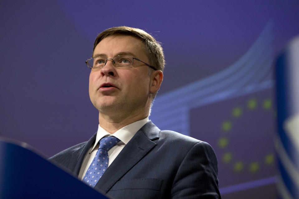European Commissioner for Euro and Social Dialogue Valdis Dombrovkis speaks during a media conference at EU headquarters in Brussels, Wednesday, Dec. 19, 2018. The European Commission says it has reached an agreement with Italy to avert action over the country's budget plans, which the EU's executive arm had warned could break euro currency rules. (AP Photo/Virginia Mayo)