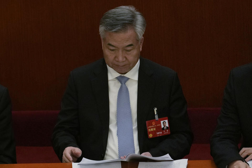 Politburo Standing Committee member Li Xi attends a session of China's National People's Congress (NPC) at the Great Hall of the People in Beijing, Tuesday, March 7, 2023. Prior to his appointment to the standing committee, Li Xi, 66, headed Guangdong province, one of China's wealthiest regions and the base of its vast manufacturing sector. He earlier served as party secretary of Mao Zedong' s famed revolutionary base of Yan'an and had became an early pioneer in what is known as "red tourism," promoting sites hallowed to the party's history prior to its seizure of power in 1949. (AP Photo/Ng Han Guan)