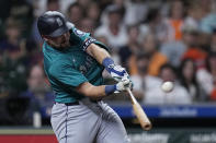 Seattle Mariners' Cal Raleigh hits a two-run home run during the sixth inning of a baseball game against the Houston Astros Saturday, May 4, 2024, in Houston. (AP Photo/Kevin M. Cox)