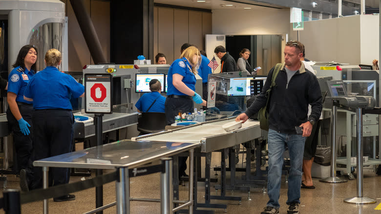 man walking through tsa security