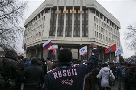 A man gestures during a pro-Russian rally outside the Crimean parliament building in Simferopol February 27, 2014. REUTERS/Baz Ratner