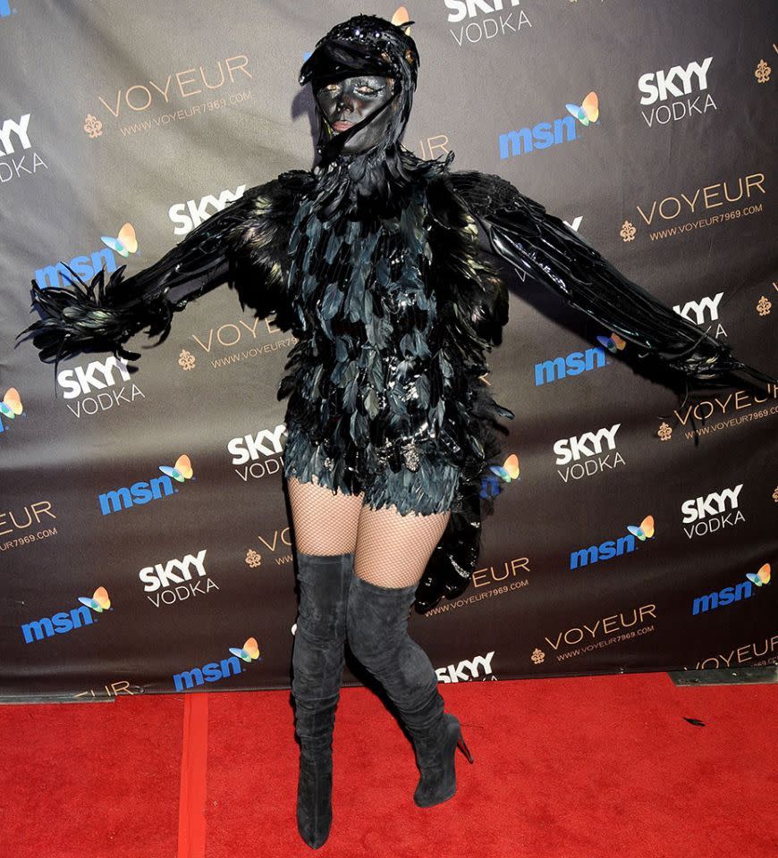 <p>No. 16: Her costume wasn’t much to crow about in 2009. Although a lot of work went into creating the elaborate feathery getup, which certainly got an “A” for effort, ultimately it disguised the <i>Project Runway</i> host too much. She got lost in the crowd — and she shouldn’t have at her own party. (Photo: Gregg DeGuire/FilmMagic) </p>