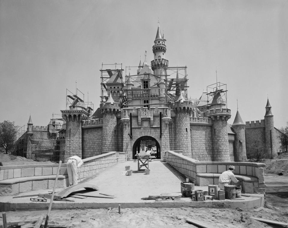 Workmen (in the foreground) help ready Sleeping Beauty Castle for Disneyland's opening in July 1955.