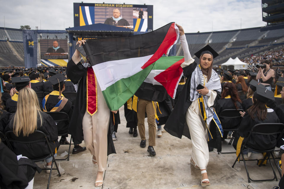 FILE - Pro-Palestinian protesters demonstrate during the University of Michigan's Spring 2024 Commencement Ceremony at Michigan Stadium in Ann Arbor, Mich., May 4, 2024. The University of Michigan and the City University of New York didn't adequately investigate if campus protests in response to the Israel-Hamas war and other incidents created a hostile environment for students, faculty and staff. That's according to results of U.S. Education Department investigations announced Monday. (Katy Kildee/Detroit News via AP, File)