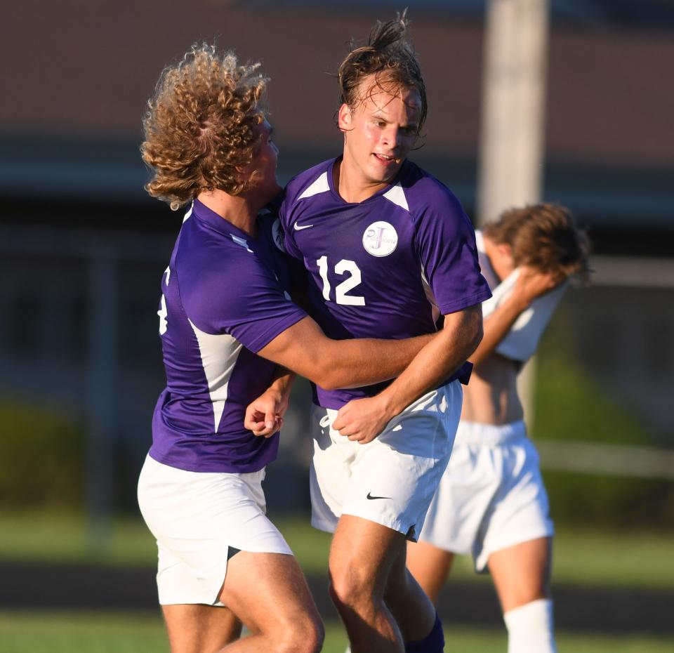 Jackson's Geoffrey Dolan, right, celebrates a goal with  J Morrow during the first half against Green boys soccer at Jackson Rick Neitzelt Stadium.   Tuesday,  Aug. 29, 2023.