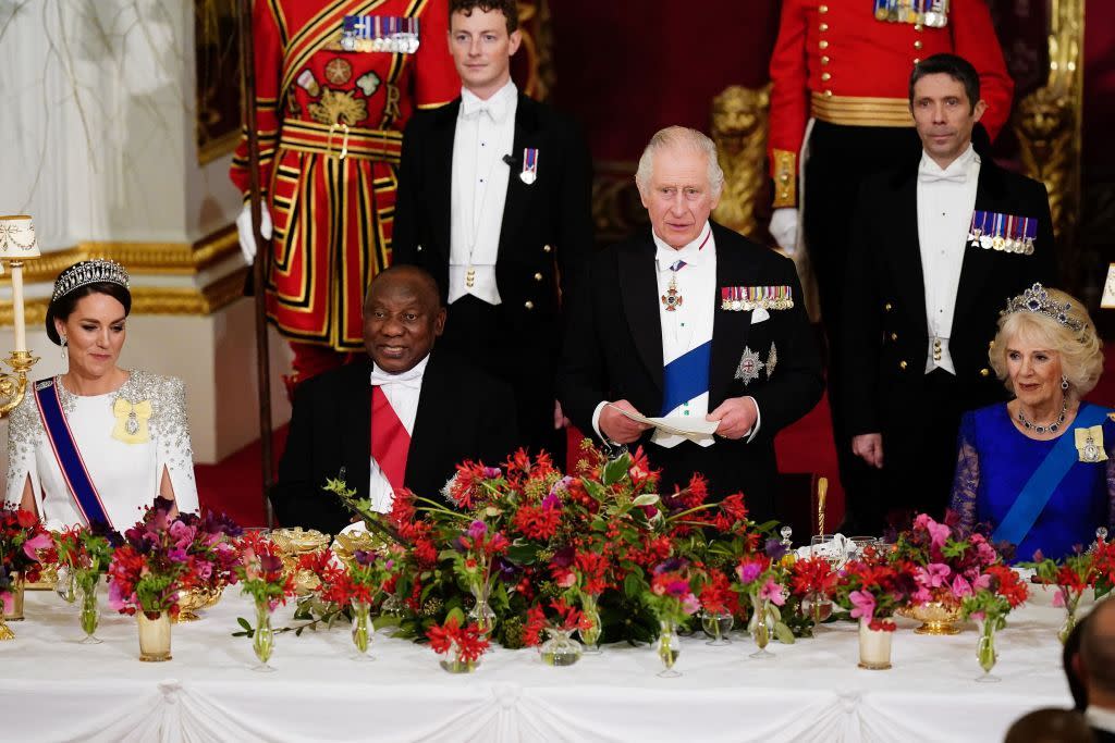 topshot   britains catherine, princess of wales l, south africas president cyril ramaphosa 2l, and britains camilla, queen consort r listen as britains king charles iii speaks during a state banquet at buckingham palace in london on november 22, 2022, at the start of the presidents of south africas two day state visit   king charles iii hosted his first state visit as monarch on tuesday, welcoming south africas president to buckingham palace photo by aaron chown  pool  afp photo by aaron chownpoolafp via getty images