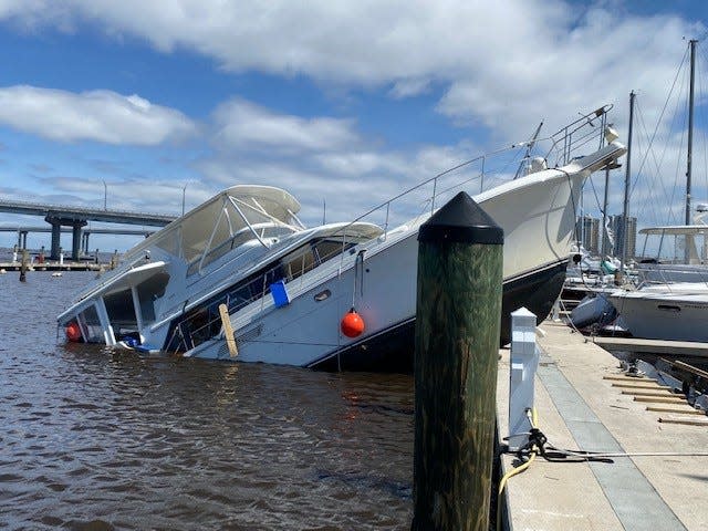 Boats damaged and washed ashore at the Fort Myers Yacht Basin and Centennial Park from Hurricane Ian.