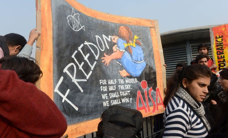 Indian university students march with placards during protest march in New Delhi on December 31, 2012. The family of an Indian gang-rape victim said Monday they would not rest until her killers are hanged as police finalised their investigation before charges are laid against suspects this week