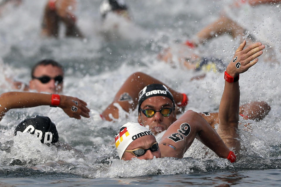 Rob Muffels of Germany competes in the men's 10km open water swim at the World Swimming Championships in Yeosu, South Korea, Tuesday, July 16, 2019. (AP Photo/Mark Schiefelbein)