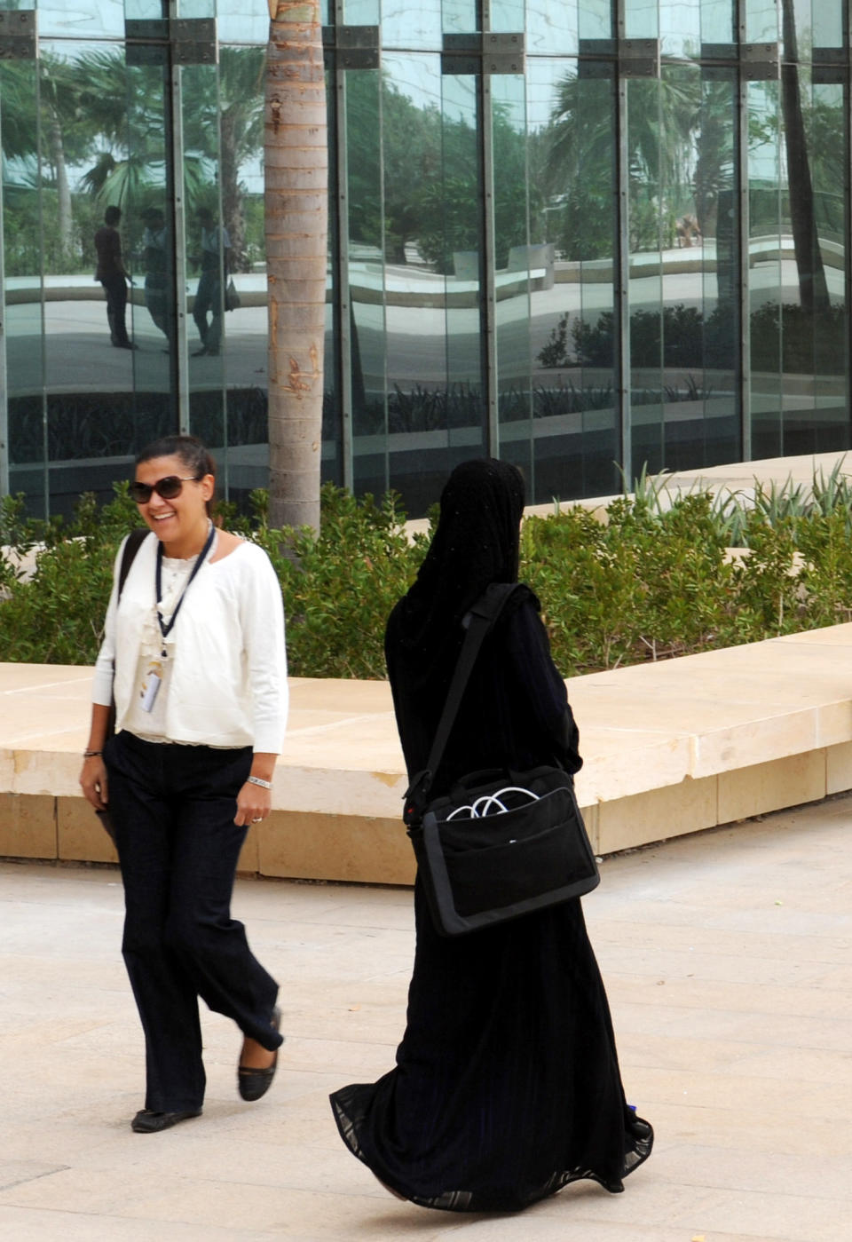 Women are given licenses to practice law. The four women with permits will face conservative male judges who have wide discretion to remove a lawyer from a case before them.  <em>Two women walk on campus at the King Abdullah University of Science and Technology (KAUST) on October 13, 2009, in Thuwal, 80 kilometers north of Jeddah. (Omar Salem/AFP/Getty Images)</em>