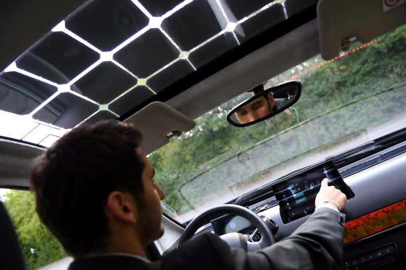 FILE PHOTO: Laurin Hahn, co-founder of German solar car company Sono Motors, sits behind the steering wheel of their prototype car "Sion" in Munich