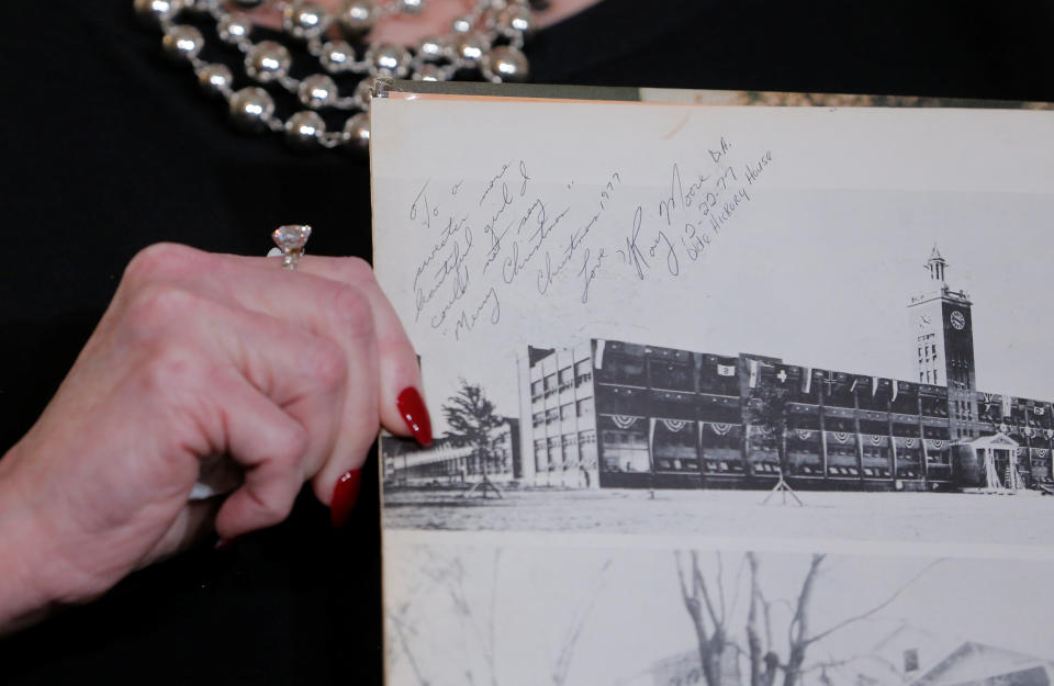 Beverly Nelson displays a page from her high school year book allegedly signed by Roy Moore