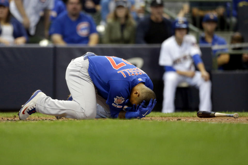 Chicago Cubs' Addison Russell falls to the ground after being hit by a pitch during the third inning of a baseball game against the Milwaukee Brewers, Sunday, Sept. 8, 2019, in Milwaukee. (AP Photo/Aaron Gash)