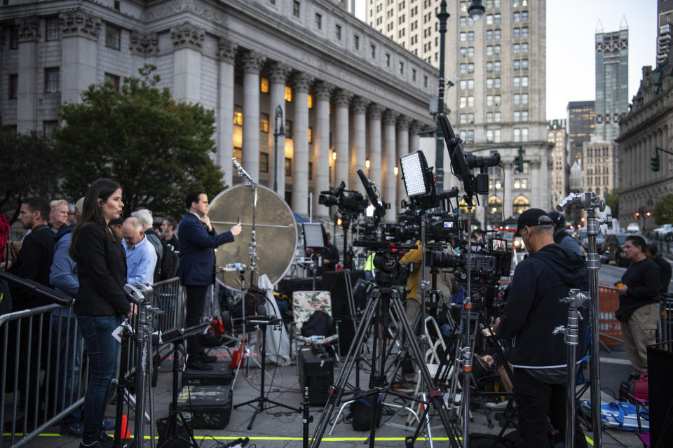 Members of the press set up outside of the court building ahead of former President Donald Trump's civil trial on Monday, Oct. 2, 2023 in New York. (AP Photo/Brittainy Newman)