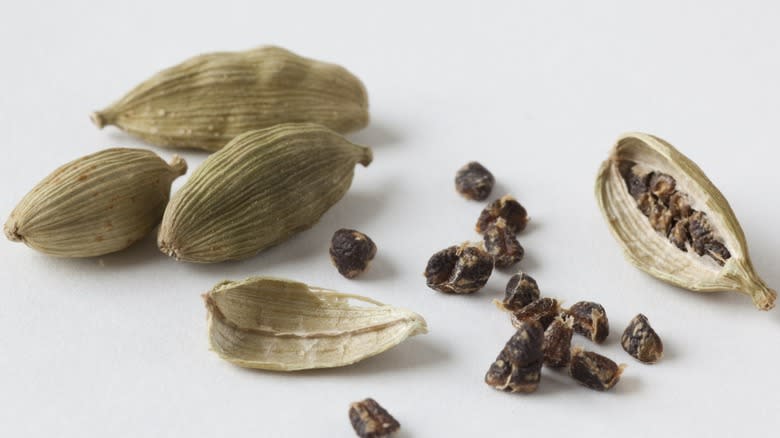 White cardamom pods with seeds exposed 