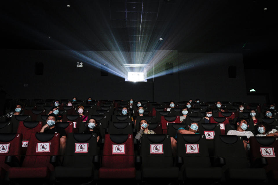 WUHAN, CHINA - JULY 20: (CHINA OUT)Residents watch a movie in a cinema in Wuhan on July 20, 2020 in Wuhan ,Hubei Province,China.Taking various measures against COVID-19, cinemas in the city reopened in an orderly manner on Monday. The China Film Administration, in a circular last week, allowed cinemas in low-risk areas to resume operation with effective epidemic prevention measures in place. (Photo by Getty Images)